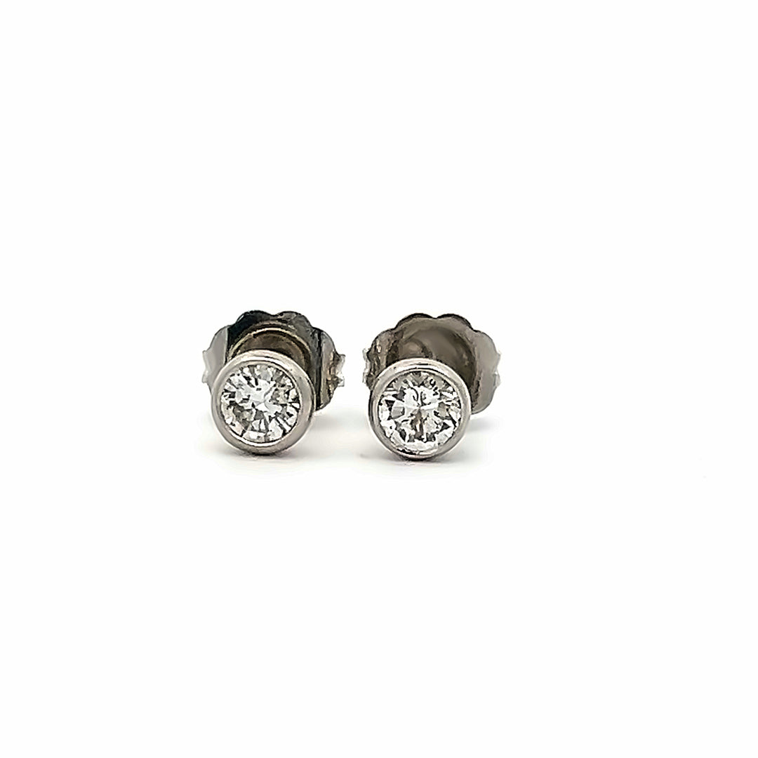 Platinum 0.60 Carat Bezel Set Diamond Stud Earrings